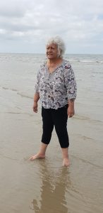 Tia re-connecting with the Sea on our beach trip from Green Gables - Homestyle Aged Care, aged care, aged care excursion, aged care lifestyle program, aged care melbourne, aged care trip, beach trip, the beach